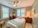 Cozy bedroom with two windows, a comfortable bed, and vintage furniture at 436 8Th Avenue Nw Dr, Hickory, NC 28601