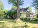 Charming single-story home with a welcoming front porch and a lush green lawn at 436 8Th Avenue Nw Dr, Hickory, NC 28601
