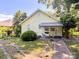Quaint home featuring a small patio with table and chairs and landscaping at 436 8Th Avenue Nw Dr, Hickory, NC 28601