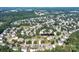 Aerial view of homes in a well-established neighborhood with tree-lined streets and ample greenery at 4392 Sunset Rose Dr, Fort Mill, SC 29708
