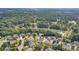 An aerial perspective of the property highlighting the home's location with waterfront views and lush surroundings at 4392 Sunset Rose Dr, Fort Mill, SC 29708