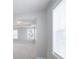 Bright bedroom featuring neutral paint, carpeted floors, and abundant natural light through multiple windows at 4392 Sunset Rose Dr, Fort Mill, SC 29708