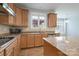 Kitchen with granite countertops, wooden cabinets, a range hood, stainless steel appliances, and a central island at 4392 Sunset Rose Dr, Fort Mill, SC 29708