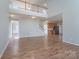 Open-concept living area featuring wood floors, neutral paint, and an upper floor overlook at 4392 Sunset Rose Dr, Fort Mill, SC 29708