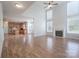 Spacious living room boasts a fireplace, high ceilings, and an open-concept design leading to the kitchen at 4392 Sunset Rose Dr, Fort Mill, SC 29708