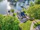 Stunning aerial view of the lakefront property, showcasing the house, gardens, and serene surroundings at 445 Sundown Rd, Mooresville, NC 28117