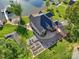 Aerial view of a stunning lakefront property with lush greenery and a private dock at 445 Sundown Rd, Mooresville, NC 28117