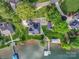 Overhead shot of an amazing waterfront property featuring a beautifully landscaped yard and private dock at 445 Sundown Rd, Mooresville, NC 28117