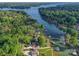 Gorgeous aerial view of lakefront homes with lush greenery and private docks along the tranquil water at 445 Sundown Rd, Mooresville, NC 28117
