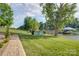 Beautiful landscaped backyard with manicured lawn and lake views at 445 Sundown Rd, Mooresville, NC 28117
