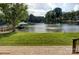 Relaxing waterfront backyard overlooking a tranquil lake and a private dock at 445 Sundown Rd, Mooresville, NC 28117