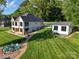 Beautiful backyard with a fire pit and an expansive, well-maintained lawn at 445 Sundown Rd, Mooresville, NC 28117