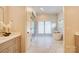A luxurious bathroom with a soaking tub, marble floors, a separate shower and lots of natural light at 445 Sundown Rd, Mooresville, NC 28117