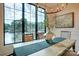 Dining room featuring a modern chandelier, lake view, and wainscoting at 445 Sundown Rd, Mooresville, NC 28117