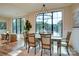 Open-concept dining room with lake views and hardwood floors at 445 Sundown Rd, Mooresville, NC 28117