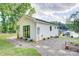 Charming white cottage-style home with a lakeside view and well-maintained landscaping at 445 Sundown Rd, Mooresville, NC 28117