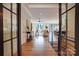 Welcoming foyer leading to an open-concept living space with hardwood floors and stylish decor at 445 Sundown Rd, Mooresville, NC 28117