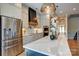 Modern kitchen with a large island, stainless steel appliances, and pendant lighting at 445 Sundown Rd, Mooresville, NC 28117