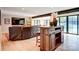 A living room with a bar, a sofa and a view of the water through several windows at 445 Sundown Rd, Mooresville, NC 28117