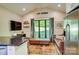 Cozy living room with a view of Lake Norman, featuring a comfortable leather couch and decor at 445 Sundown Rd, Mooresville, NC 28117