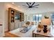 Cozy living room featuring a built-in entertainment center, comfortable seating, and hardwood floors at 445 Sundown Rd, Mooresville, NC 28117