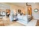Elegant main bedroom featuring a four-poster bed, hardwood floors, and stylish decor at 445 Sundown Rd, Mooresville, NC 28117