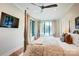 The main bedroom features a four-poster bed and lots of natural light from the many windows overlooking the water at 445 Sundown Rd, Mooresville, NC 28117
