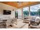 Covered porch with outdoor furniture and a view of the lake at 445 Sundown Rd, Mooresville, NC 28117
