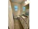 Well-lit bathroom with a granite countertop, a toilet, and a tiled floor at 5005 Blue Serenity Ct, Denver, NC 28037