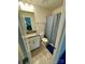 Bathroom showcasing a single vanity with granite countertops, shower with blue curtain at 5005 Blue Serenity Ct, Denver, NC 28037
