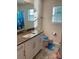 Bathroom featuring granite countertop, white cabinetry, and playful fish-themed accessories at 5005 Blue Serenity Ct, Denver, NC 28037