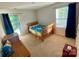 Bright bedroom with blue curtains and a wooden framed bed at 5005 Blue Serenity Ct, Denver, NC 28037