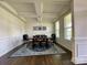 Formal dining room featuring coffered ceiling, wainscoting, and abundant natural light at 5005 Blue Serenity Ct, Denver, NC 28037