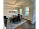 Formal dining room featuring coffered ceiling, wainscoting, and abundant natural light at 5005 Blue Serenity Ct, Denver, NC 28037