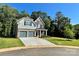 A charming two-story home with a lush lawn and inviting driveway at 5005 Blue Serenity Ct, Denver, NC 28037