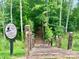 Sylvan Creek natural trail entrance with wooden steps and a sign indicating trail difficulty at 5005 Blue Serenity Ct, Denver, NC 28037