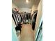 Spacious walk-in closet with ample storage racks and organized shelving for clothes and accessories at 5005 Blue Serenity Ct, Denver, NC 28037