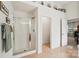 Bathroom with a glass-enclosed shower, tile flooring, and open doorway to the toilet at 5021 Meadow Woods Dr, Lowell, NC 28098