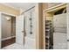 Well-lit bathroom with a tub, shower, and in-unit laundry conveniently located in a nearby closet at 5021 Meadow Woods Dr, Lowell, NC 28098