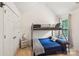 Bedroom featuring a bunk bed, vaulted ceiling, and neutral decor at 5021 Meadow Woods Dr, Lowell, NC 28098