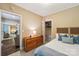 Comfortable bedroom with a dresser, closet, soft carpet and a view to the living area at 5021 Meadow Woods Dr, Lowell, NC 28098