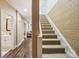 Hallway with access to the basement, featuring wood and brick accents at 5021 Meadow Woods Dr, Lowell, NC 28098