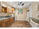 Small kitchenette with wood cabinets, granite countertops, and white appliances at 5021 Meadow Woods Dr, Lowell, NC 28098