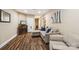 Inviting living room with wood floors, a fireplace, and a comfortable couch with blue decorative pillows at 5021 Meadow Woods Dr, Lowell, NC 28098