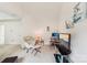 Bright living room featuring a vaulted ceiling, comfortable chair, and television area at 5021 Meadow Woods Dr, Lowell, NC 28098