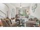 Cozy living room filled with natural light, comfortable seating, and stylish decor, creating a warm ambiance at 5021 Meadow Woods Dr, Lowell, NC 28098