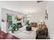 Spacious living room featuring a fireplace, large windows, and ample seating, perfect for relaxing and entertaining at 5021 Meadow Woods Dr, Lowell, NC 28098