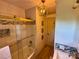 Bathroom featuring a tub with glass doors, and elegant vanity with stylish lighting at 5033 Baylor Dr, Charlotte, NC 28210