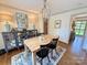 Traditional dining room with hardwood floors, a chandelier, and a hutch with mirrored doors at 5033 Baylor Dr, Charlotte, NC 28210
