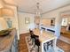 Formal dining room with a wooden table, chandelier, and hardwood floors at 5033 Baylor Dr, Charlotte, NC 28210